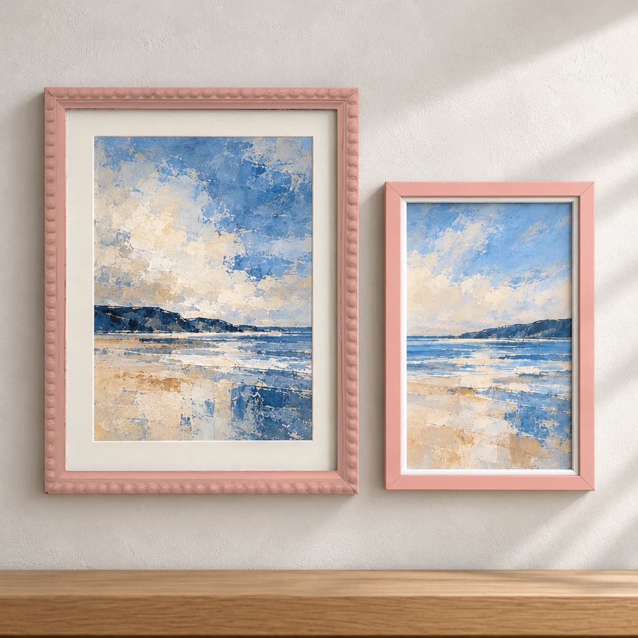 Group of pink picture frames with sample artwork