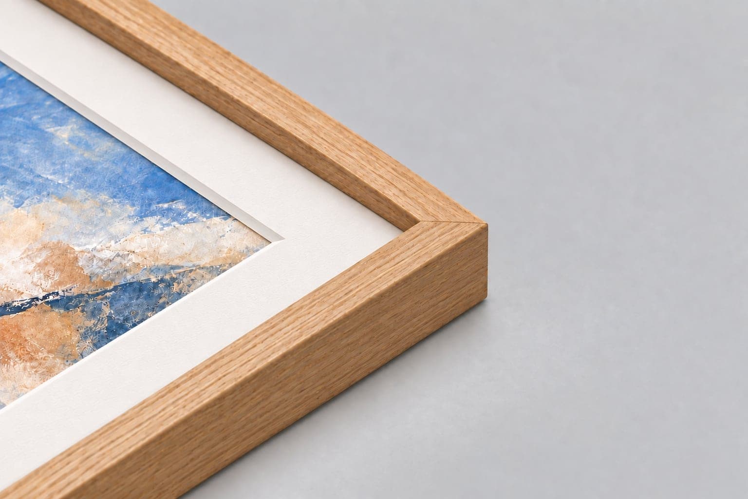 Corner of an oak frame with a white mount